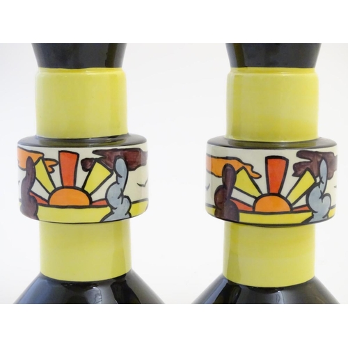 92 - A pair of candlesticks by Lorna Bailey in the pattern Dinsdale Hall. Signed under. Approx. 6 ¾'' hig... 