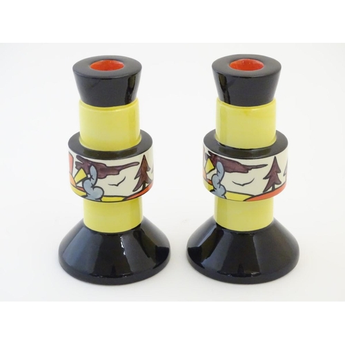 92 - A pair of candlesticks by Lorna Bailey in the pattern Dinsdale Hall. Signed under. Approx. 6 ¾'' hig... 