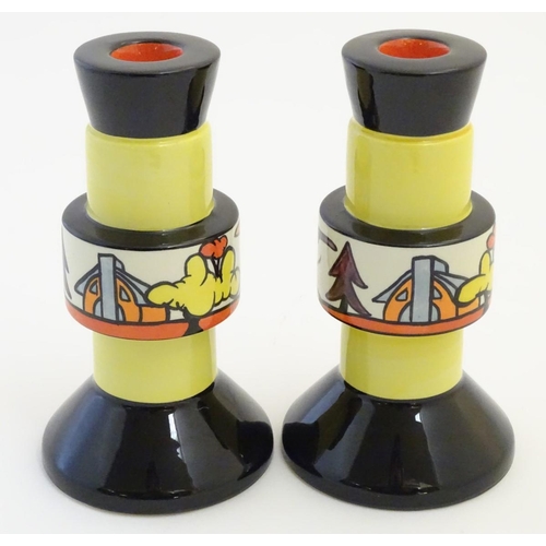 92 - A pair of candlesticks by Lorna Bailey in the pattern Dinsdale Hall. Signed under. Approx. 6 ¾'' hig... 