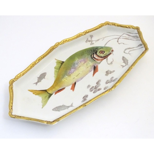 93 - A Villeroy and Boch elongated oblong serving dish with fish decoration and a gilt rim. Marked under.... 