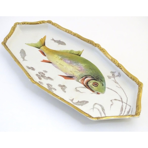 93 - A Villeroy and Boch elongated oblong serving dish with fish decoration and a gilt rim. Marked under.... 