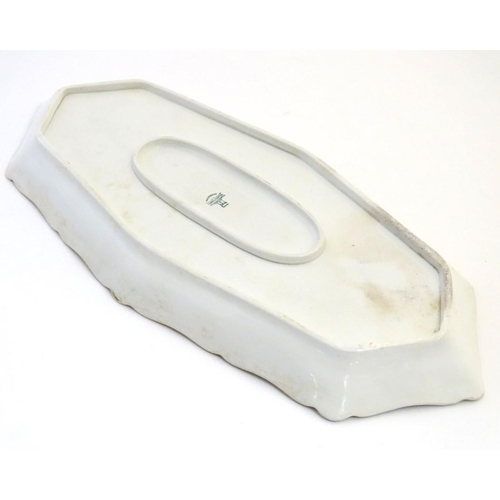 93 - A Villeroy and Boch elongated oblong serving dish with fish decoration and a gilt rim. Marked under.... 