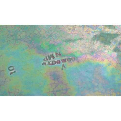 94 - A pair of Wedgwood majolica oval plates with a green lustre glaze, decorated with moulded grape vine... 