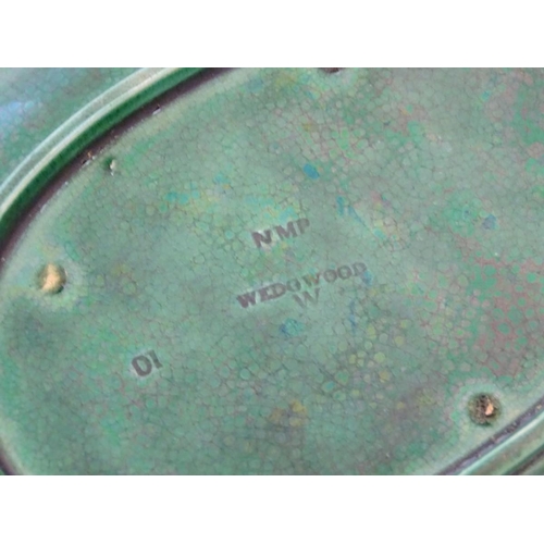 94 - A pair of Wedgwood majolica oval plates with a green lustre glaze, decorated with moulded grape vine... 