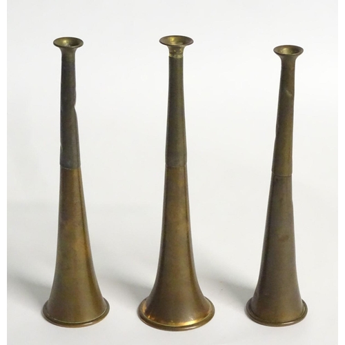181 - Hunting: Three 20thC copper and brass hunting horns. The longest approx. 9'' long.