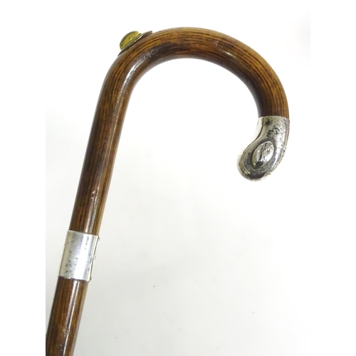 197A - A 20thC race-goer's peacock wood walking stick / cane with pencil insert to handle and silver mounts... 