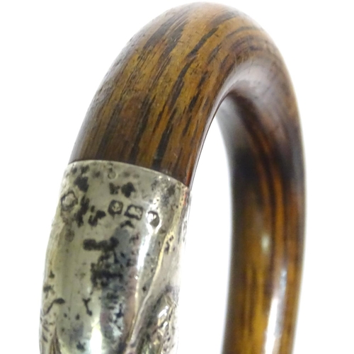 197A - A 20thC race-goer's peacock wood walking stick / cane with pencil insert to handle and silver mounts... 