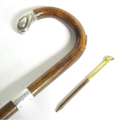 197A - A 20thC race-goer's peacock wood walking stick / cane with pencil insert to handle and silver mounts... 