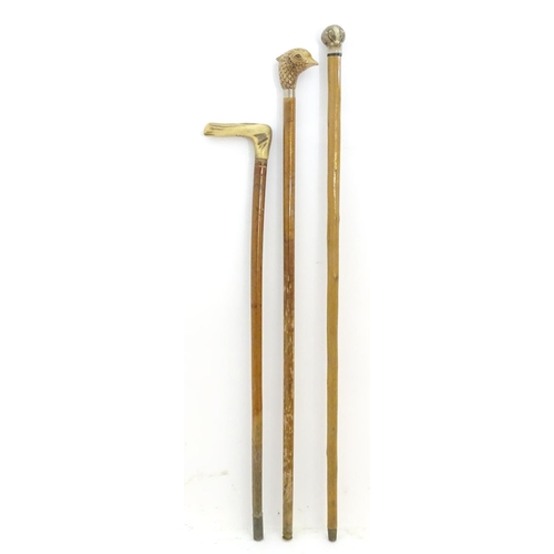 198A - Three late 20thC sticks / canes, comprising an antler handled example, one with the handle formed as... 
