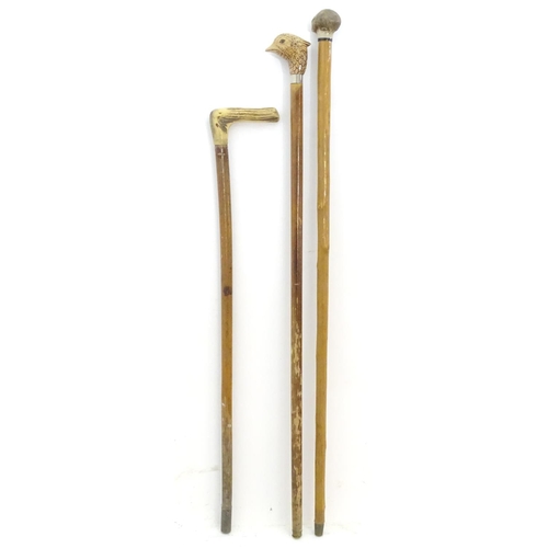 198A - Three late 20thC sticks / canes, comprising an antler handled example, one with the handle formed as... 