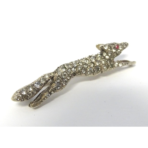 213 - A white metal brooch forme as a running fox with a profusion of white stones 1 3/4'' long