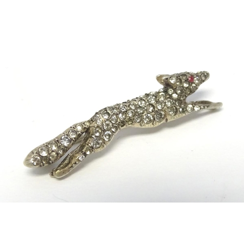 213 - A white metal brooch forme as a running fox with a profusion of white stones 1 3/4'' long