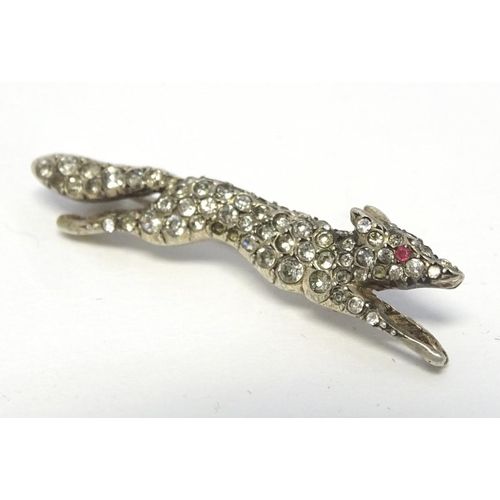213 - A white metal brooch forme as a running fox with a profusion of white stones 1 3/4'' long