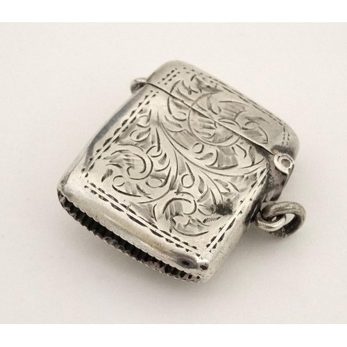 216 - A silver vesta case with later applied 21stC ceramic cabochon with dog decoration. The whole 1 3/4''... 