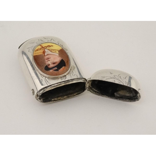 216 - A silver vesta case with later applied 21stC ceramic cabochon with dog decoration. The whole 1 3/4''... 
