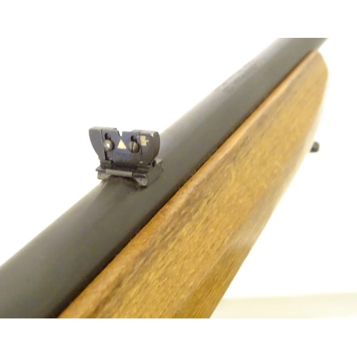 390 - Firearm: an Anschutz 'Modell 525' .22LR semi-automatic rimfire rifle, beech pistol-grip stock with c... 