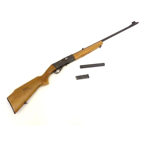 390 - Firearm: an Anschutz 'Modell 525' .22LR semi-automatic rimfire rifle, beech pistol-grip stock with c... 