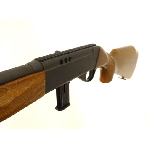 390 - Firearm: an Anschutz 'Modell 525' .22LR semi-automatic rimfire rifle, beech pistol-grip stock with c... 