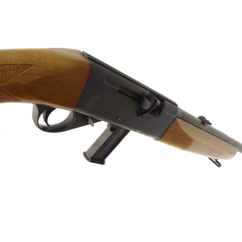 390 - Firearm: an Anschutz 'Modell 525' .22LR semi-automatic rimfire rifle, beech pistol-grip stock with c... 