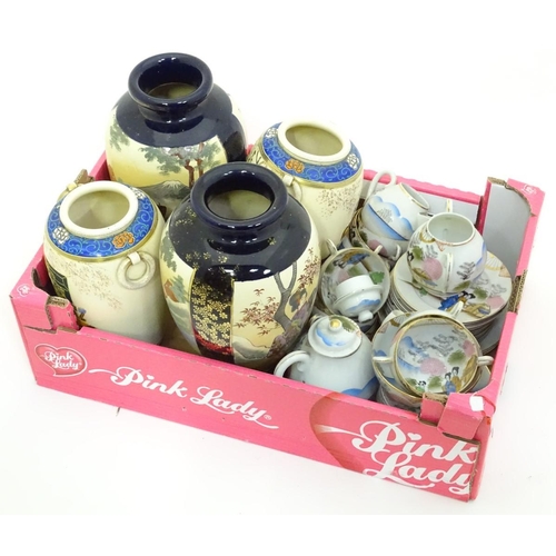 184 - A quantity of oriental ceramics, comprising tea wares and two pairs of vases
