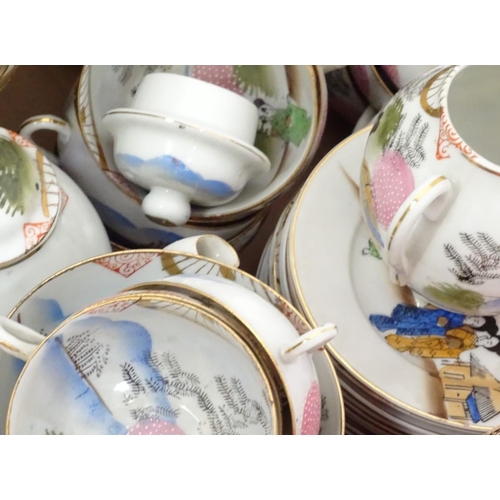 184 - A quantity of oriental ceramics, comprising tea wares and two pairs of vases