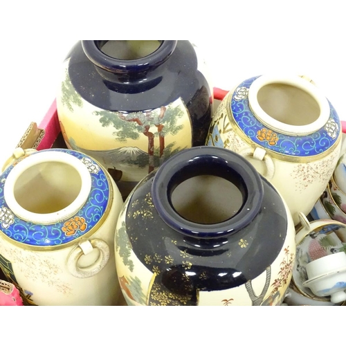 184 - A quantity of oriental ceramics, comprising tea wares and two pairs of vases