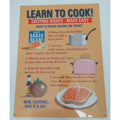 192 - A 21stC metal sign, 15 3/4'' x 11 3/4'' wide, 'Learn to Cook' 'Exciting dishes-Made easy'