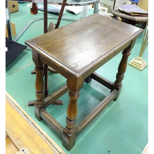 199 - A small oak stool and hardwood folding cake stand