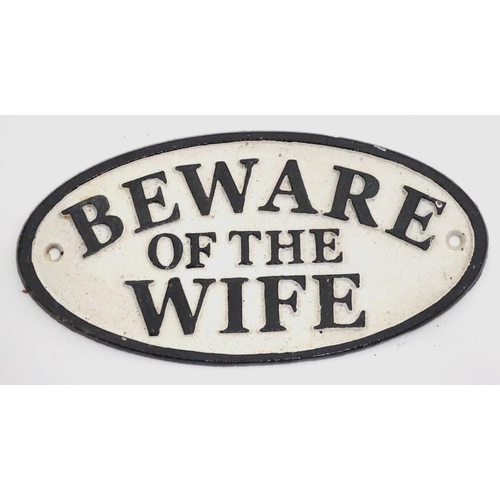 209 - A 21stC painted cast metal oval sign, 'beware of the wife', 7'' wide
