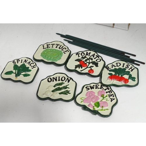 210 - A box of cast iron vegetable labels on stands