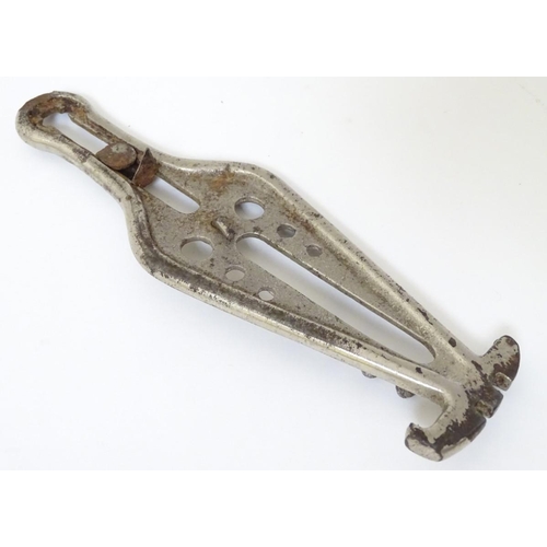 222 - A 1922 combination corkscrew with can opener, 3 inch ruler, glass cutter, a gauge and crown cork ope... 