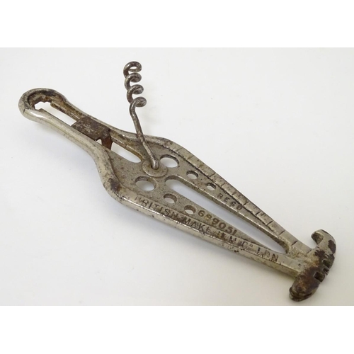 222 - A 1922 combination corkscrew with can opener, 3 inch ruler, glass cutter, a gauge and crown cork ope... 