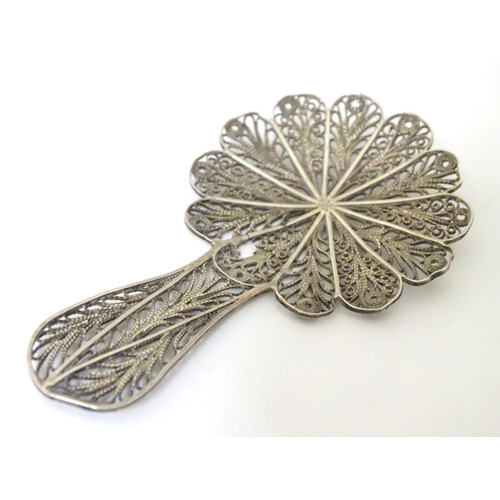 237 - A white metal filigree caddy spoon approx 3'' long