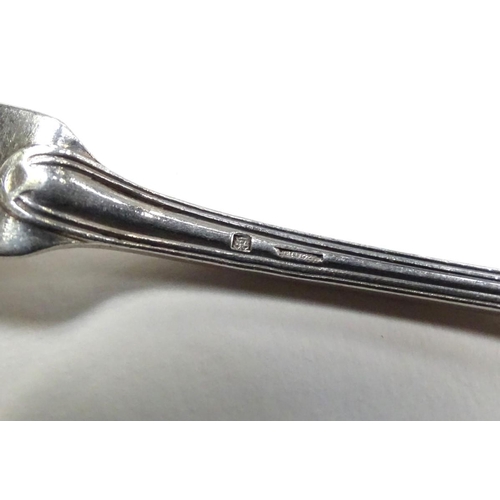241 - Five white metal fiddle pattern teaspoons together with a matching butterknife