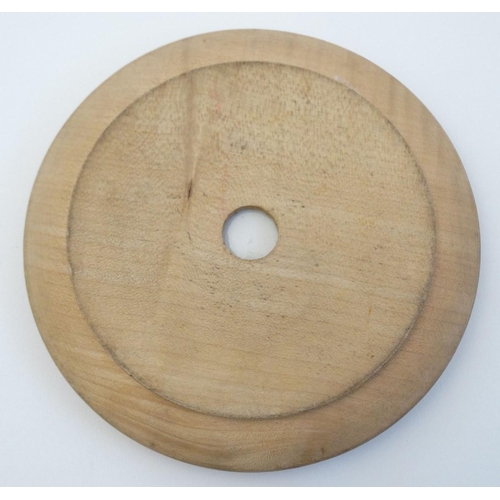 242 - A blue and white ceramic 'Willow' pattern butter dish in carved wooden surround. 6'' diameter.