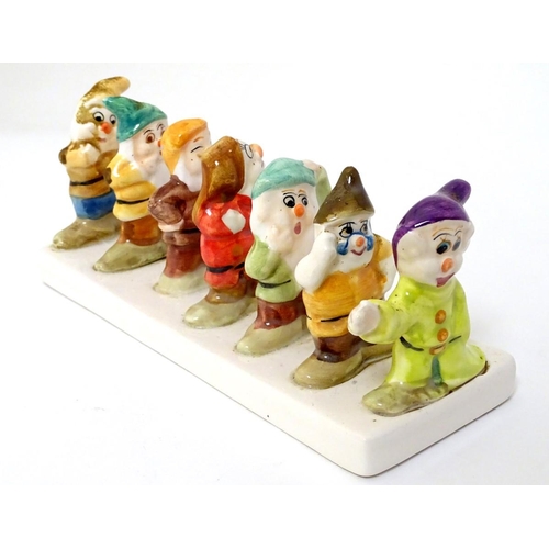 248 - 'Clover, Loved all over', an advertising ceramic toast rack in the form of Walt Disney's Classic Sno... 