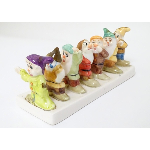 248 - 'Clover, Loved all over', an advertising ceramic toast rack in the form of Walt Disney's Classic Sno... 