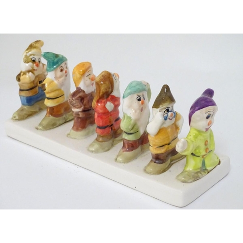 248 - 'Clover, Loved all over', an advertising ceramic toast rack in the form of Walt Disney's Classic Sno... 