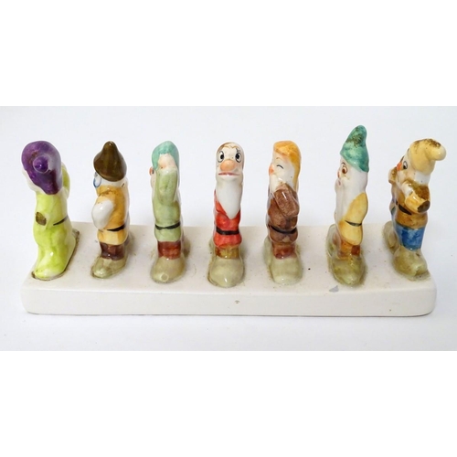 248 - 'Clover, Loved all over', an advertising ceramic toast rack in the form of Walt Disney's Classic Sno... 