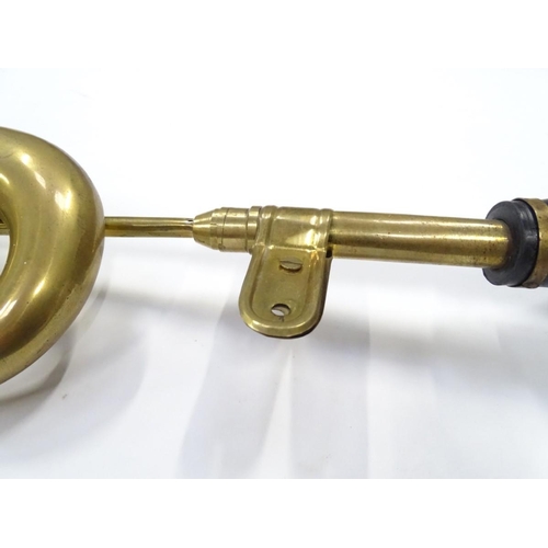 249 - An imitation brass car horn, 17'' long