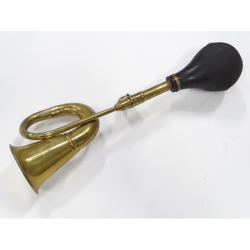 249 - An imitation brass car horn, 17'' long