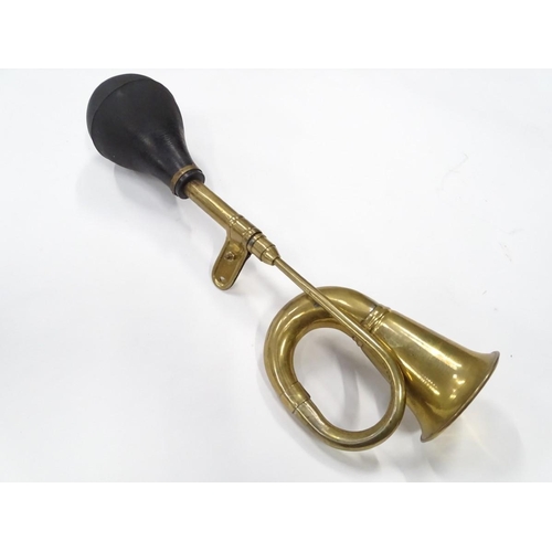 249 - An imitation brass car horn, 17'' long