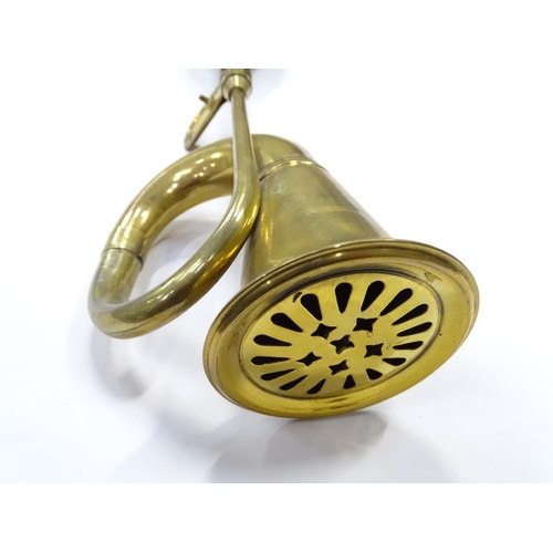 249 - An imitation brass car horn, 17'' long