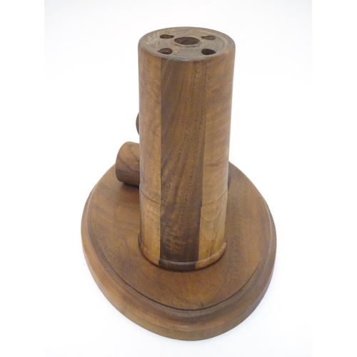 253 - Shooting: a walnut desk tidy, formed as three shotgun cartridges. 7'' tall, 9 1/2'' wide, 6'' deep