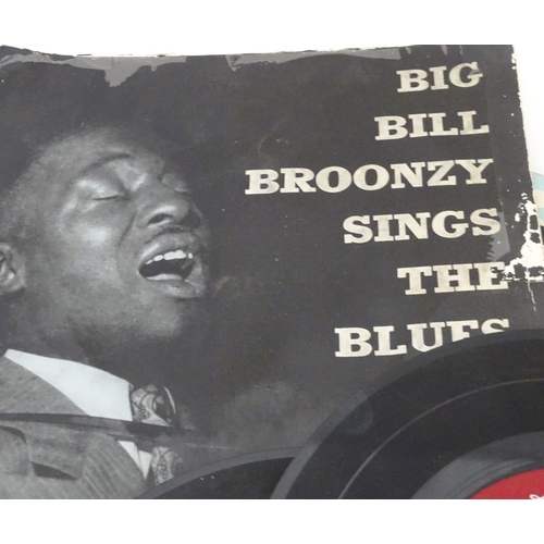 267 - A small collection of singles and EPs by Billy Holiday, Louis Armstrong, etc.