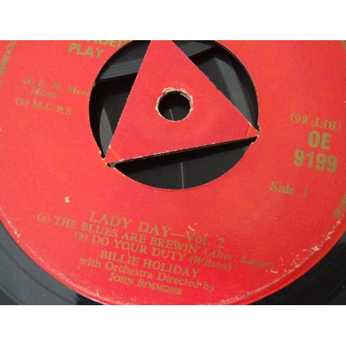 267 - A small collection of singles and EPs by Billy Holiday, Louis Armstrong, etc.