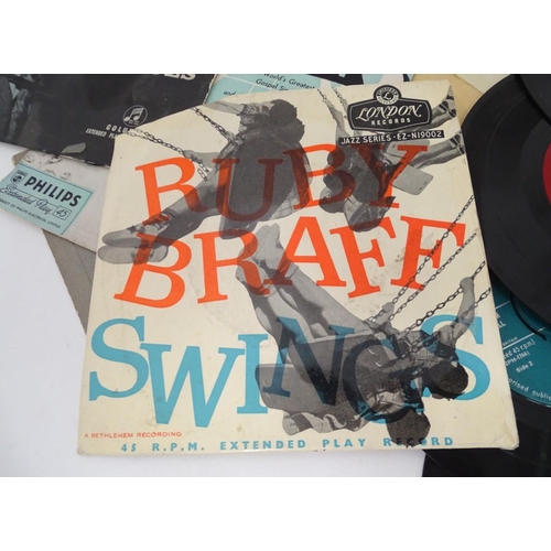 267 - A small collection of singles and EPs by Billy Holiday, Louis Armstrong, etc.