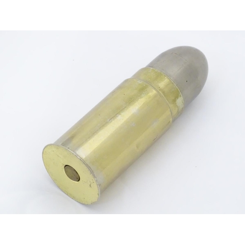 287 - A small cigarette dispenser in the form of a bullet