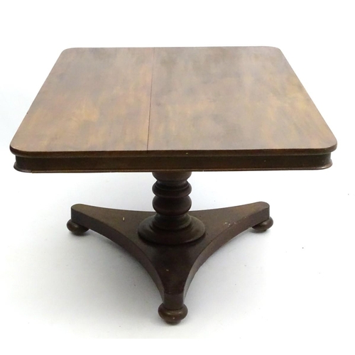 293 - A mid 19thC mahogany tilt top breakfast table, with large rectangular top above a turned column and ... 