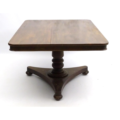 293 - A mid 19thC mahogany tilt top breakfast table, with large rectangular top above a turned column and ... 